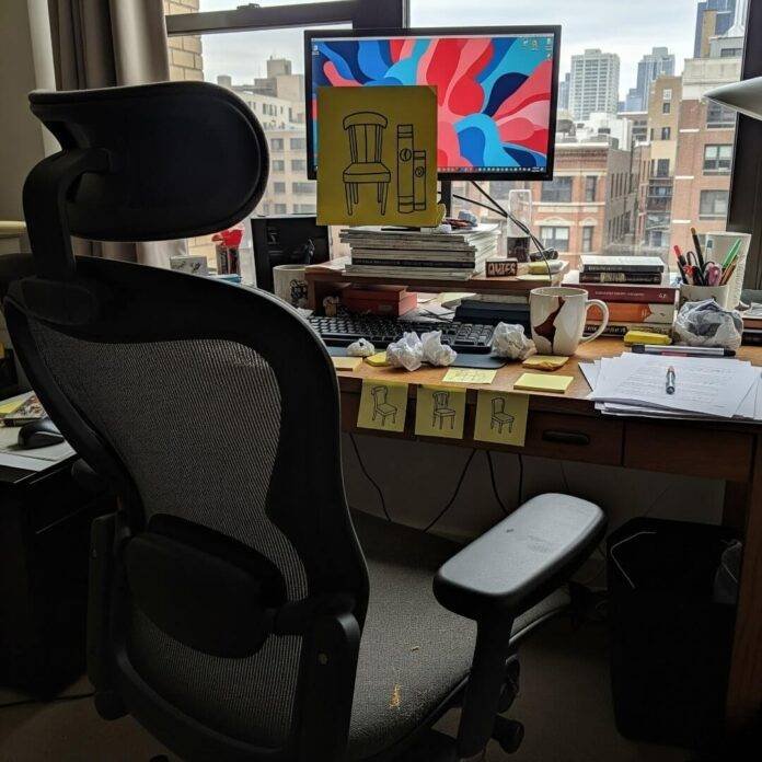 Messy Chicago Office Desk with Ergonomic Chair