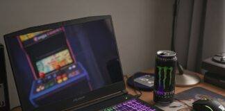 Top 5 Budget Gaming Laptops in 2025 That Don’t Suck Messy Desk Gaming Setup: Budget Laptop with RGB Keyboard & Retro Arcade Reflection