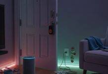 Top Smart Home Devices for 2025 (That Are Actually Worth Buying) A Cluttered Living Room with Echo, Roomba, and Yale Lock